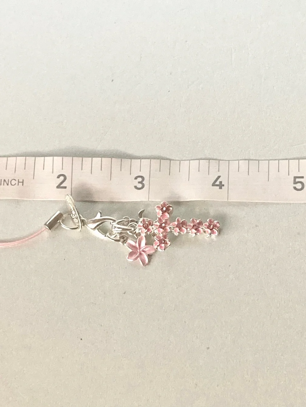 Laule’a Hawaii NWOT Pink Floral Cross phone Charm Silver Tone accessory